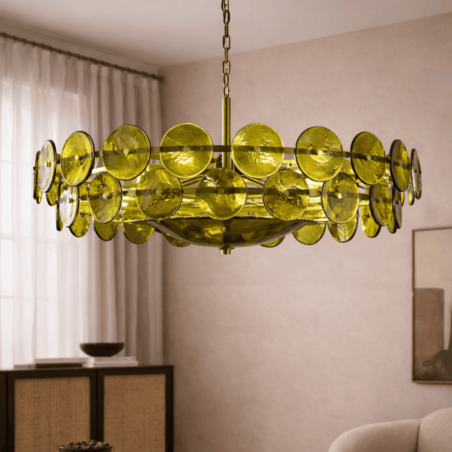 Modern chandelier with green circular lights in a room setting.