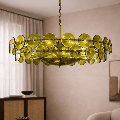 Modern chandelier with green circular lights in a room setting.