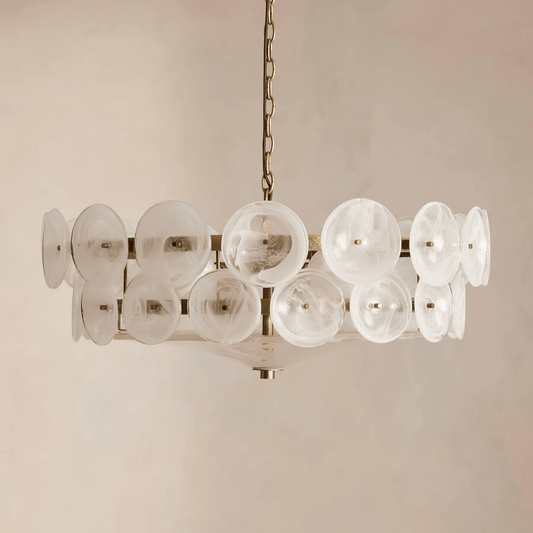 Chandelier with glass disc shades on a beige background