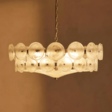 Chandelier with multiple glass shades on a brown background