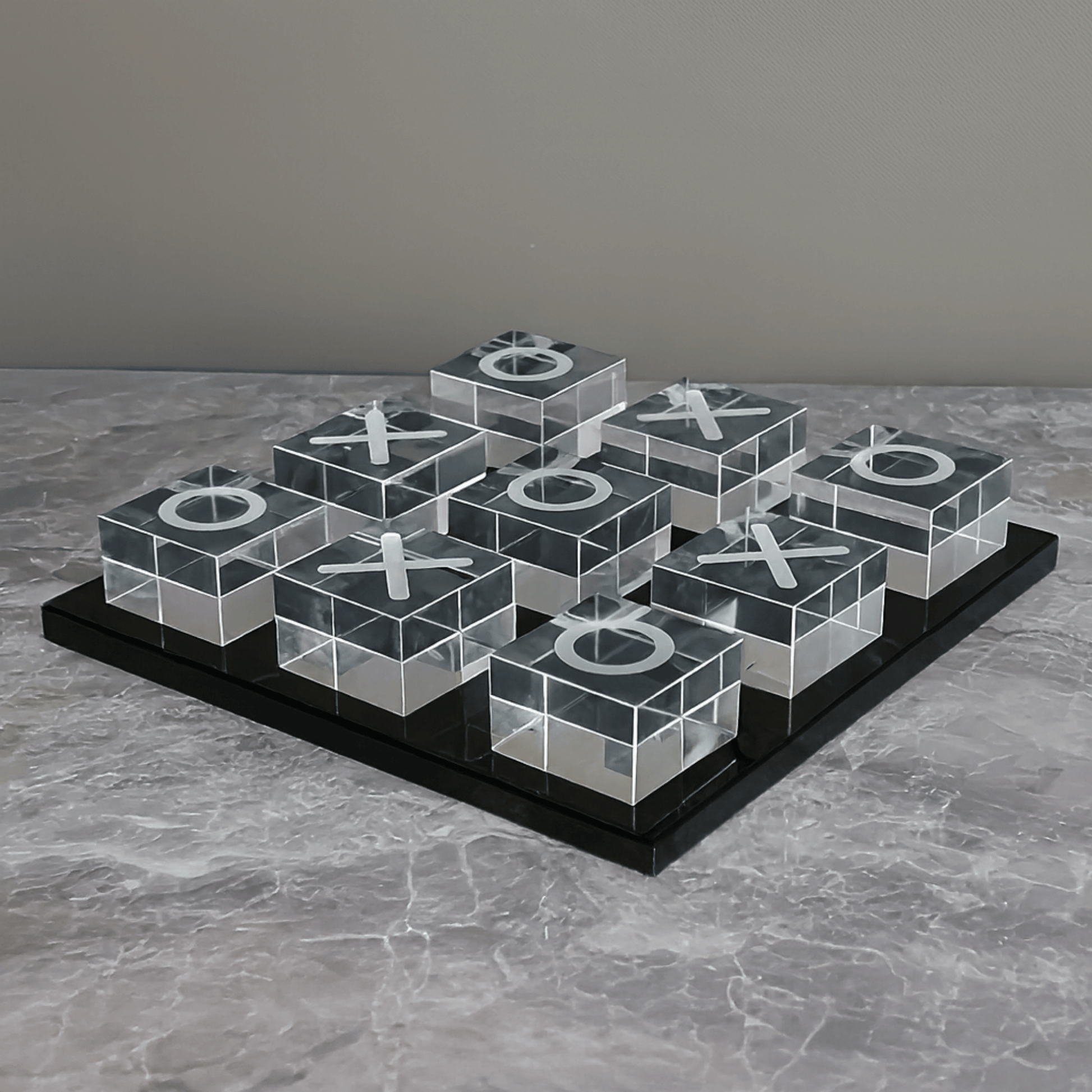 Transparent tic-tac-toe board with Xs and Os on a gray surface
