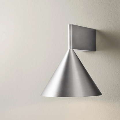 Metal wall light fixture on a plain wall