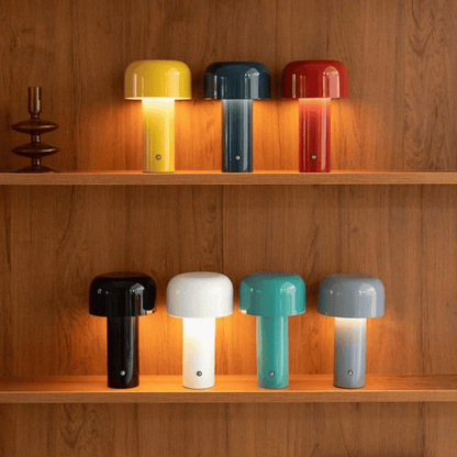 Colorful table lamps on wooden shelves