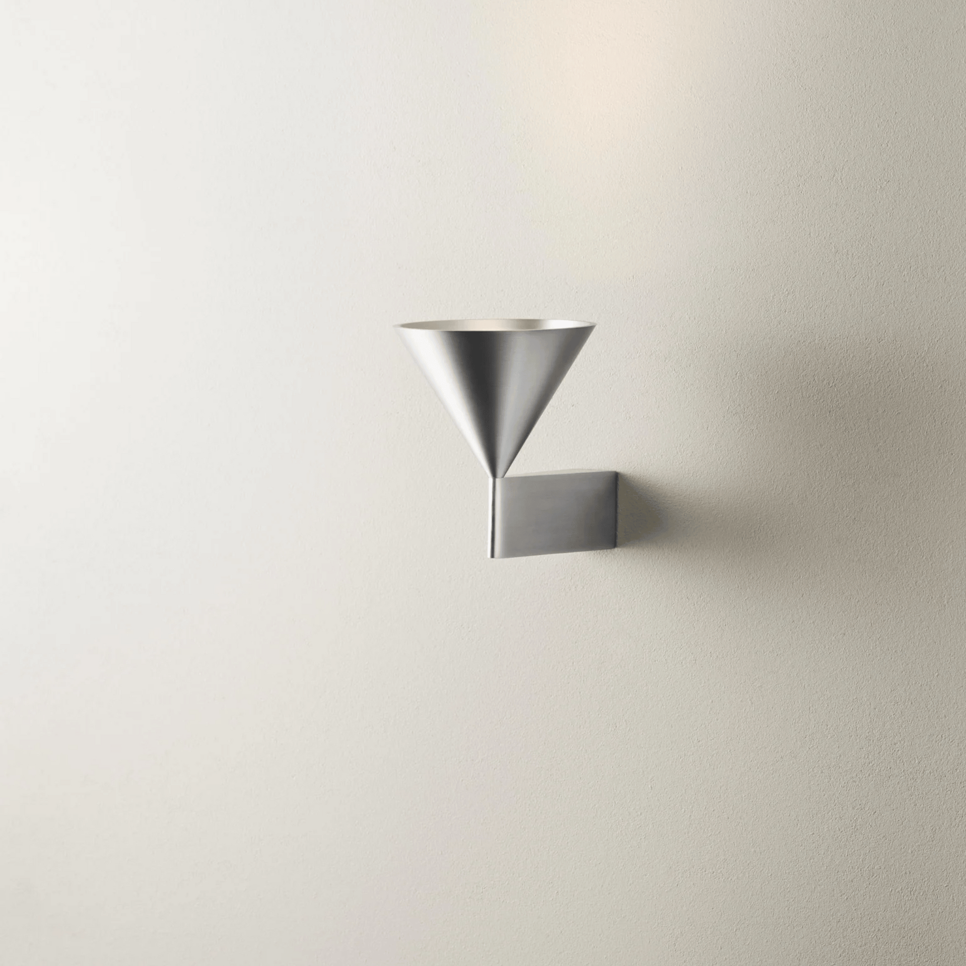 Modern wall light fixture on a plain wall