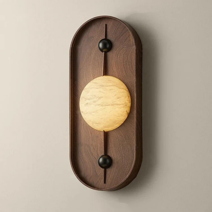 Warm glowing marble-style LED wall lamp on a curved wooden backplate.
