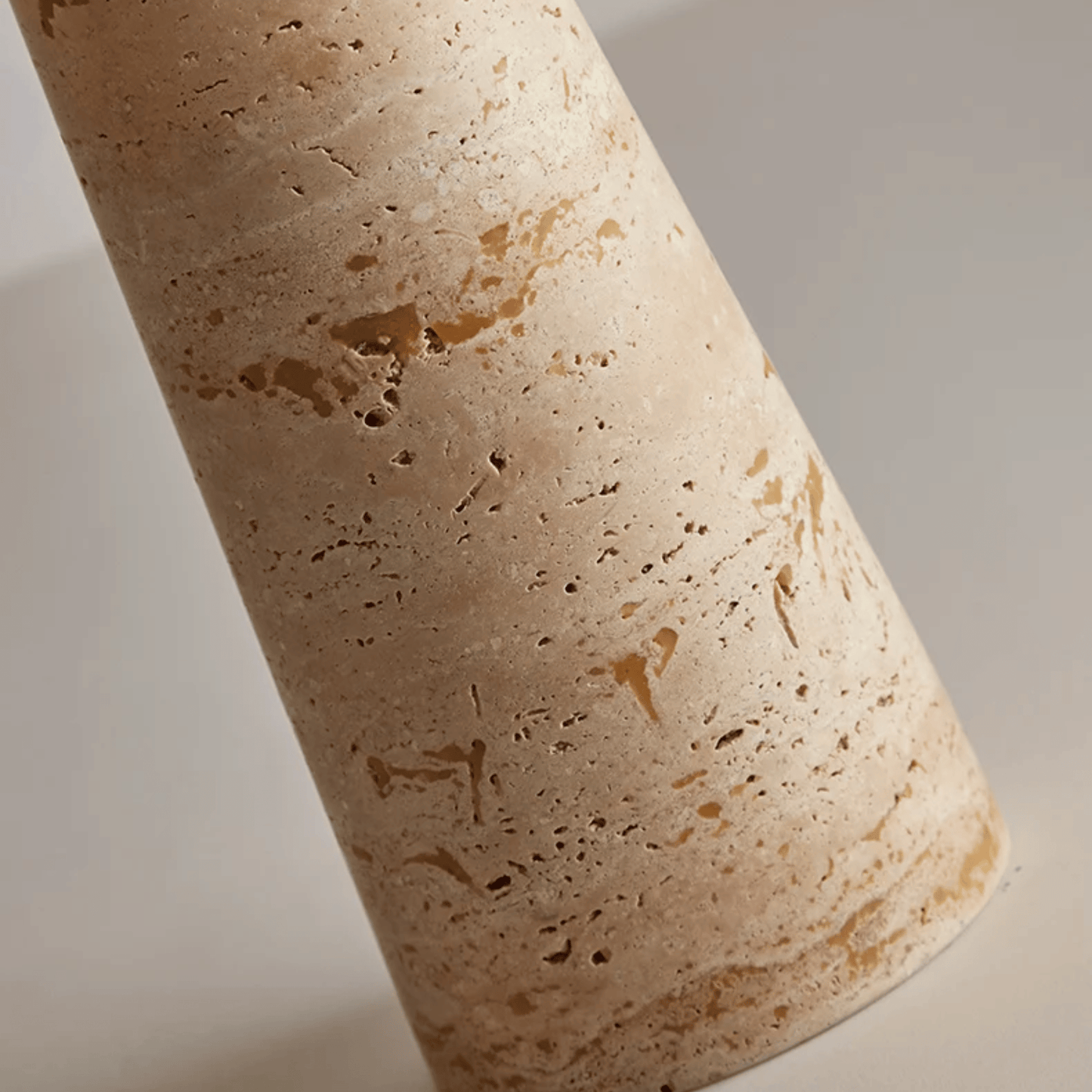 Close-up of a textured cylindrical object on a neutral background
