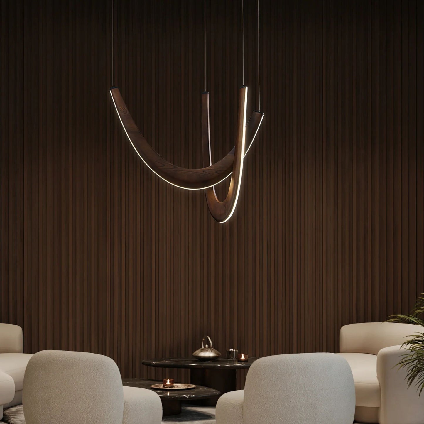 A close-up of a modern pendant light with wooden arcs and glowing bulbs, illuminating a dining area.