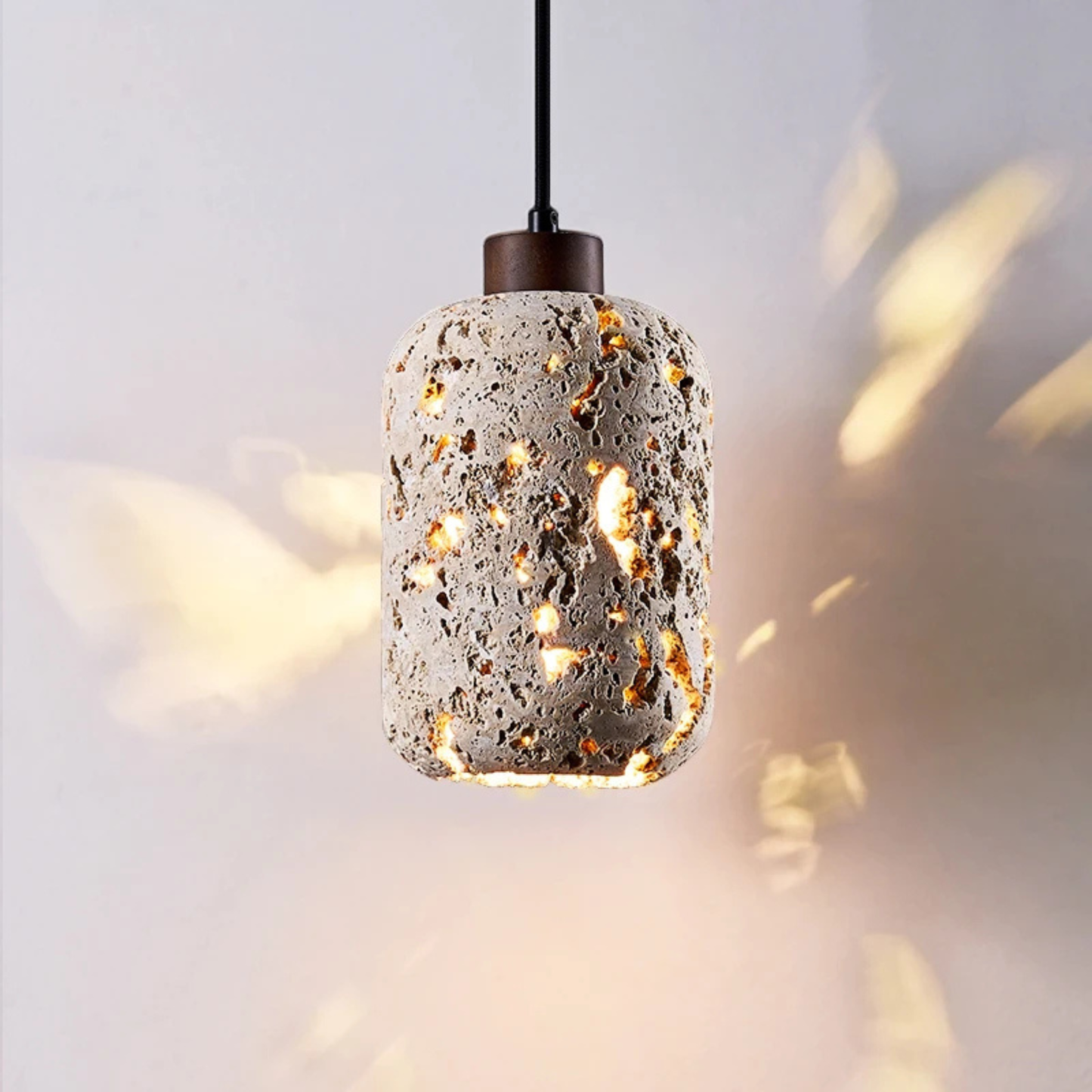 Detailed view of the lamp glowing, highlighting the textured glass surface with reflected sparkles.