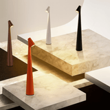 Modern table lamps on a marble surface with a neutral background
