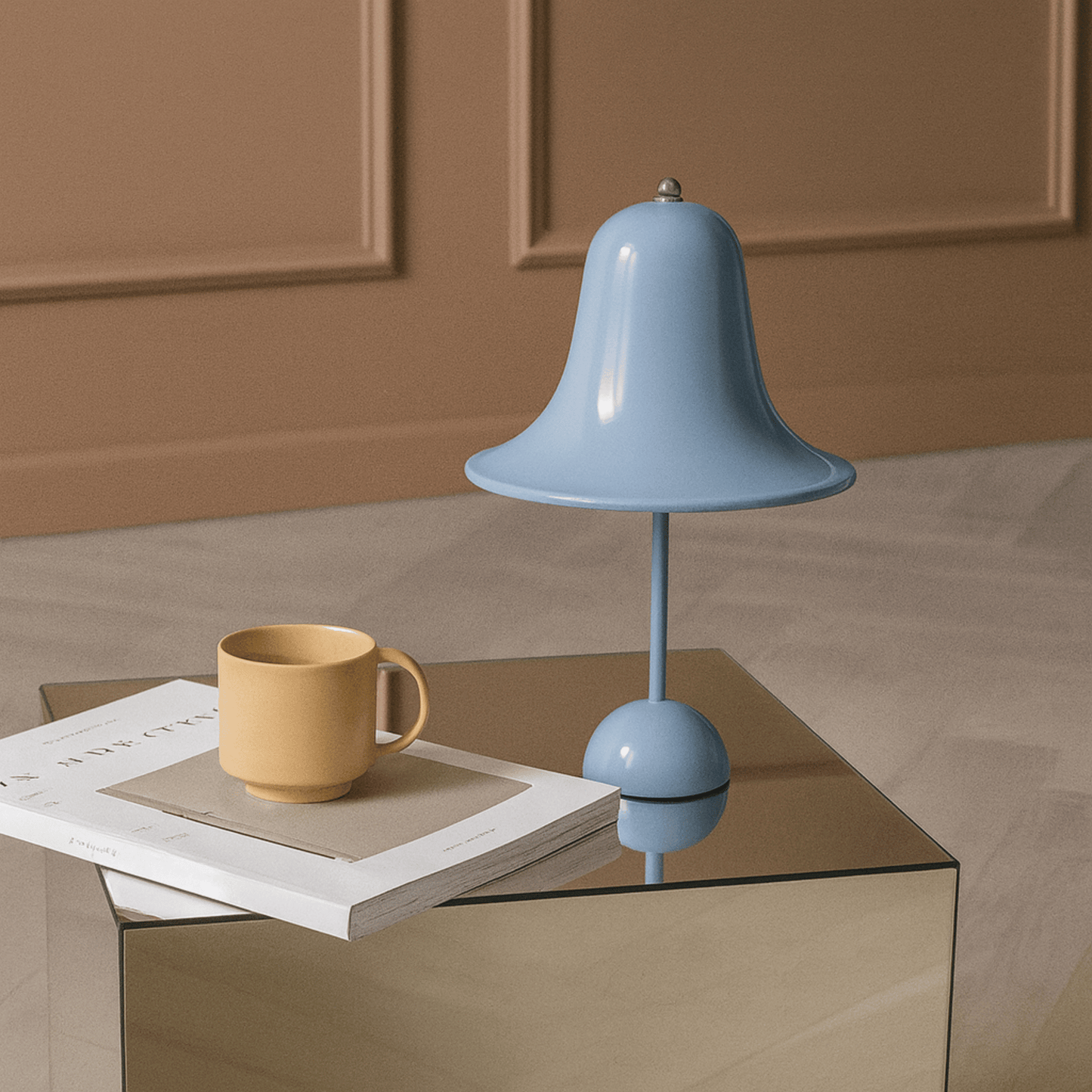 Blue lamp and yellow mug on a glass table with a brown background