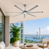 Ceiling fan in a modern living room with a cityscape view