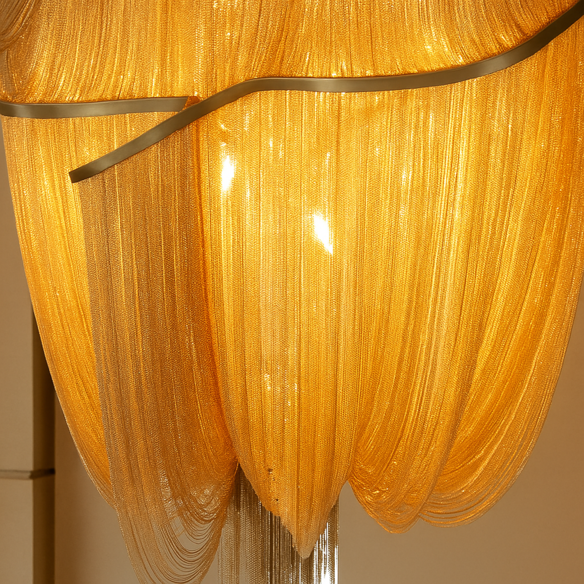 Close-up of a gold chandelier with ribbed design