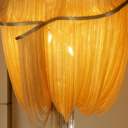 Close-up of a gold chandelier with ribbed design