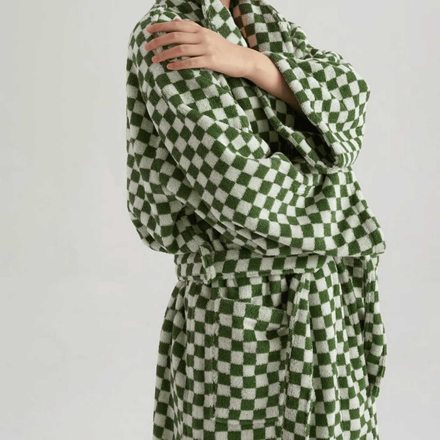 Green and white checkered robe on a plain background