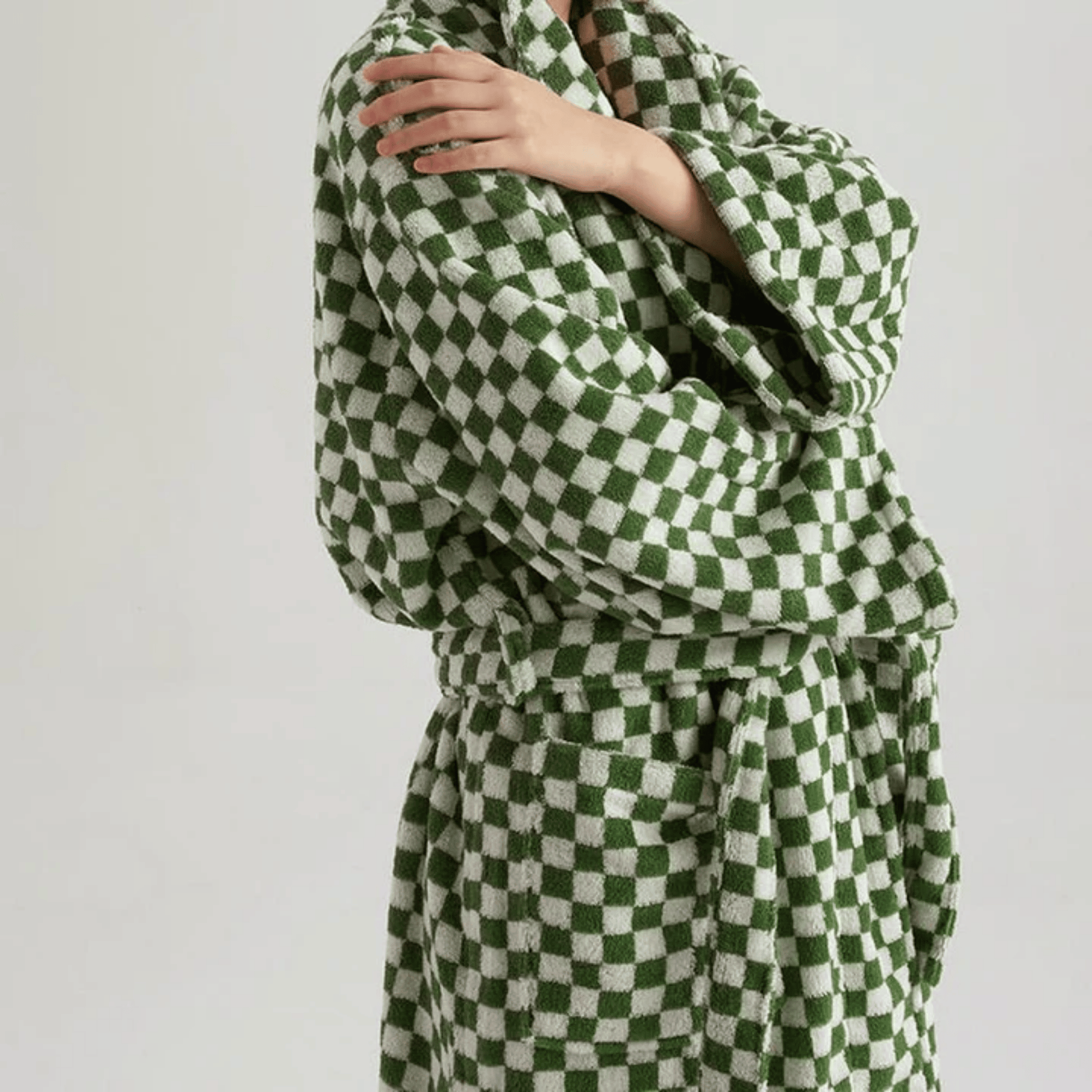 Green and white checkered robe on a plain background