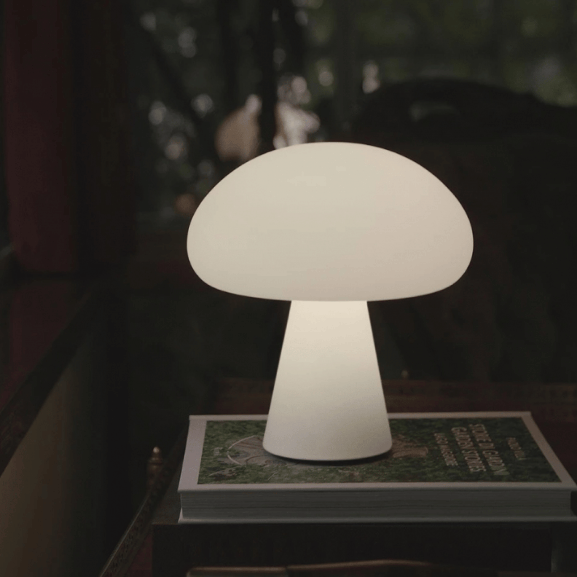 Mushroom-shaped lamp on a table with a blurred background