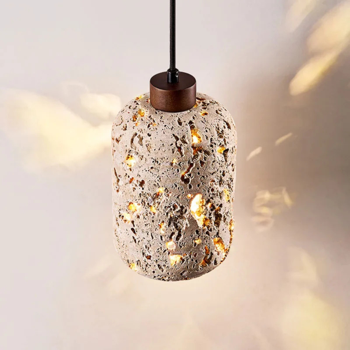 Another close-up showing the lamp hanging against a white wall, emitting a cozy and warm glow.