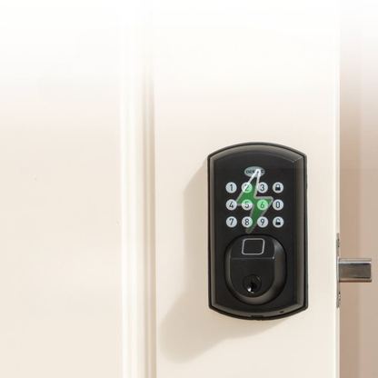 A close-up of a keypad smart lock installed on a white door, with a modern interior in the background.