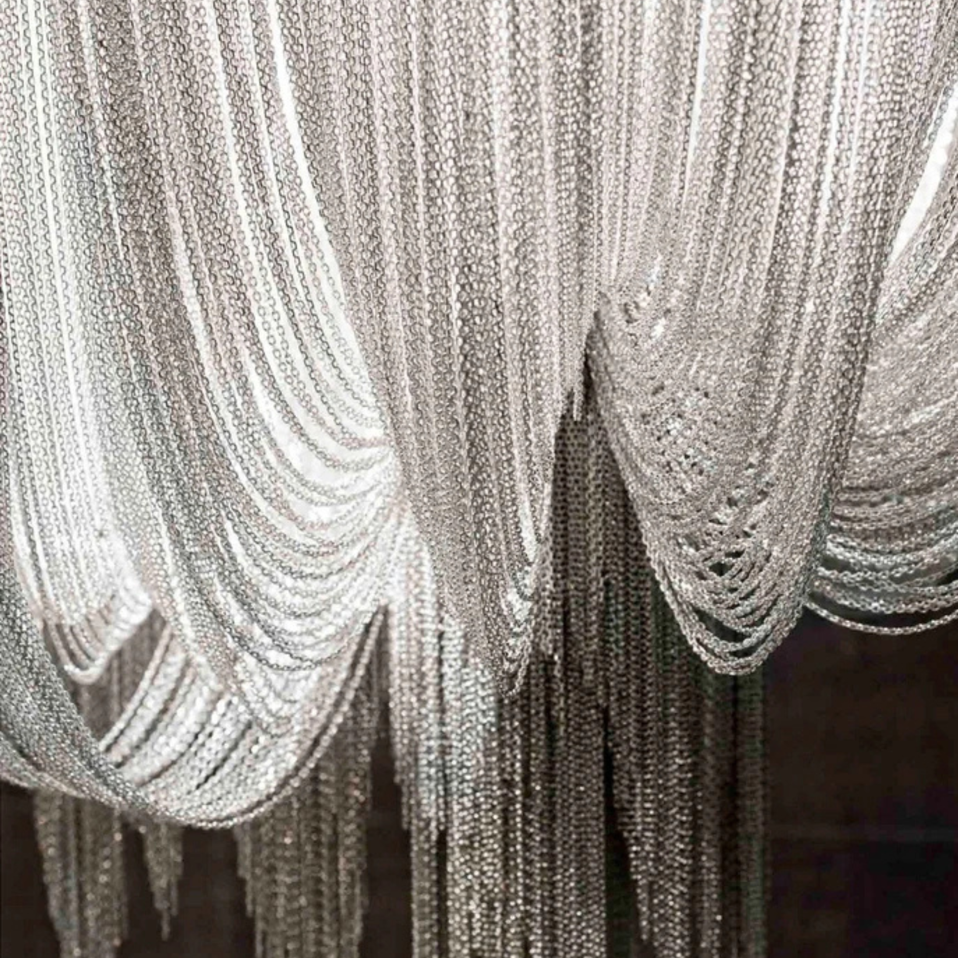Close-up of a decorative silver chain curtain