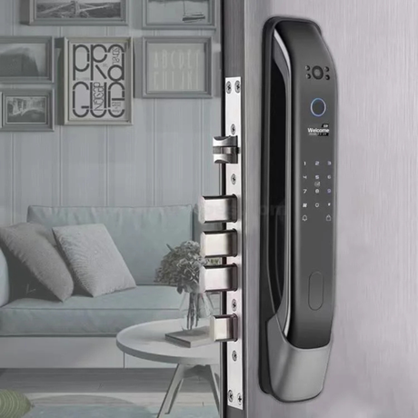 The smart door lock installed on a grey door in a contemporary living room setting.