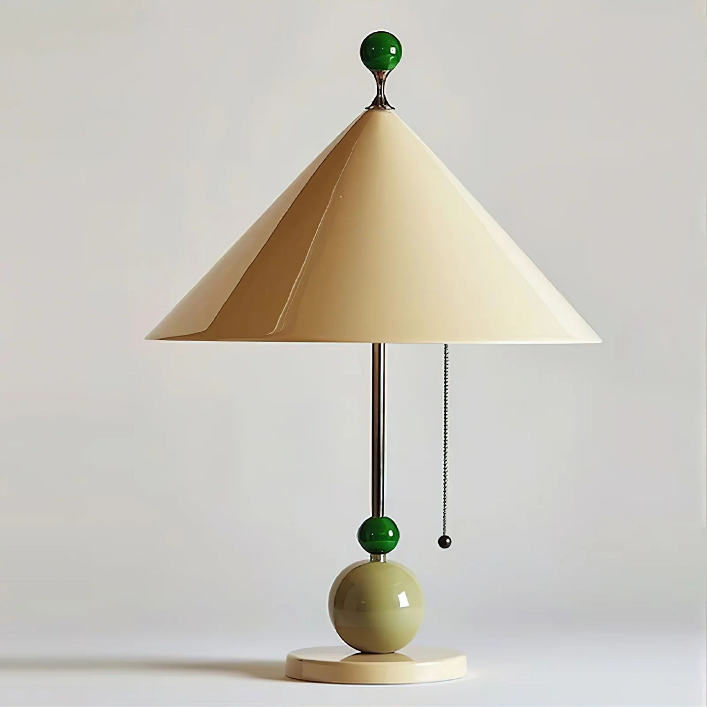 A close-up of the base of the lamp, showing the green accents and the shape of the beige lampshade.