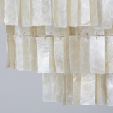 Sheer white curtain with ruffled texture on a light gray background