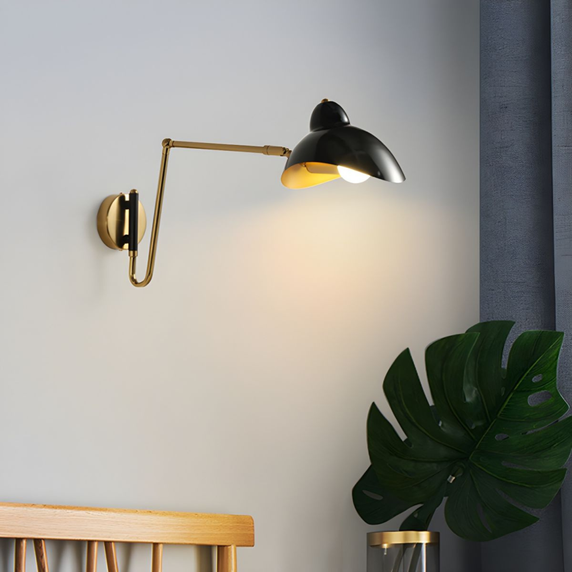 Gold and black adjustable wall lamp mounted near a wooden headboard, creating a cozy ambient glow.