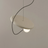 White MagnoGlow Magnetic Pendant Light styled in a bedroom — minimalist interior by Baskoraa