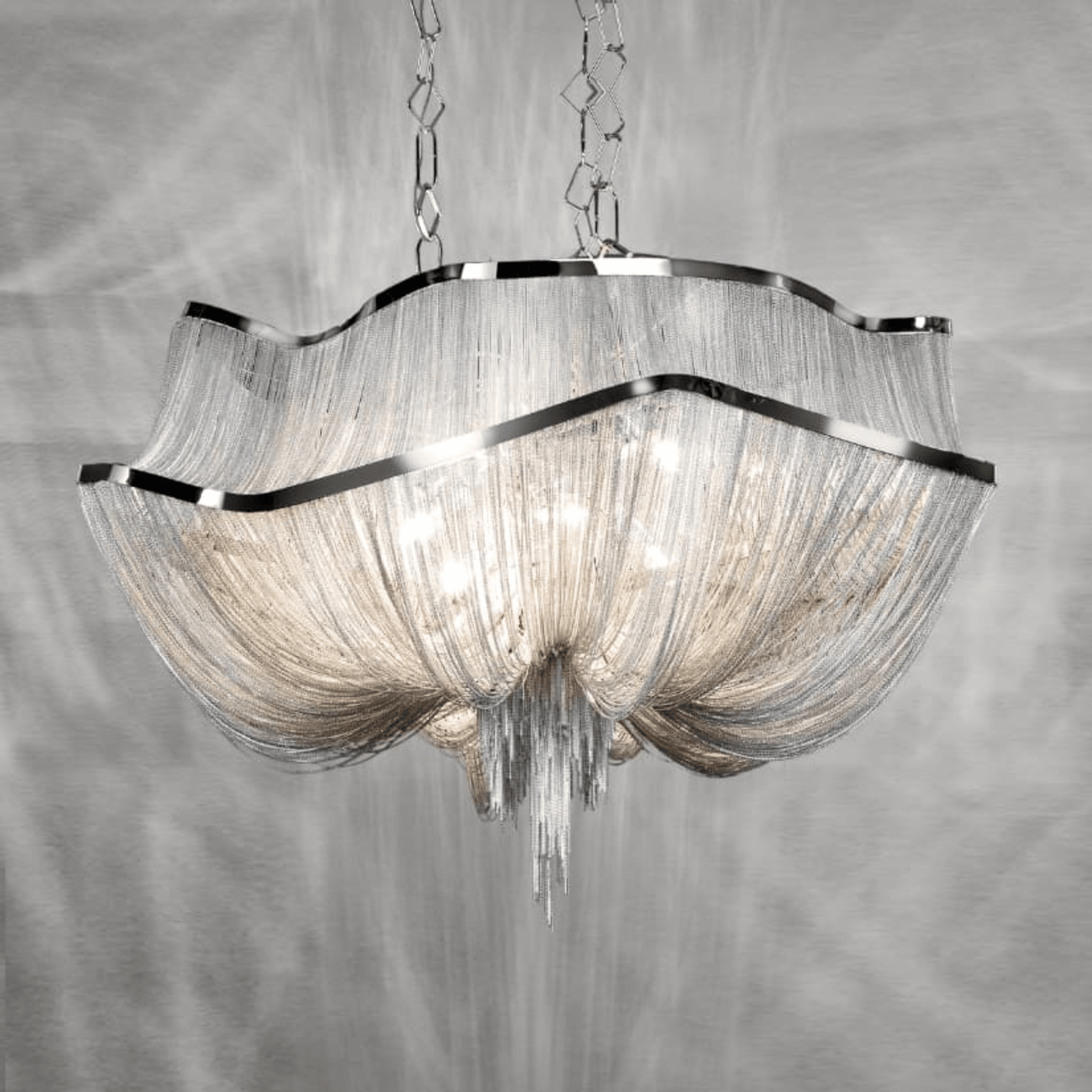Chandelier with glass shades and metallic frame on a gray background