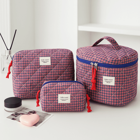 Set of three red and blue checkered bags on a white surface with a minimal background.