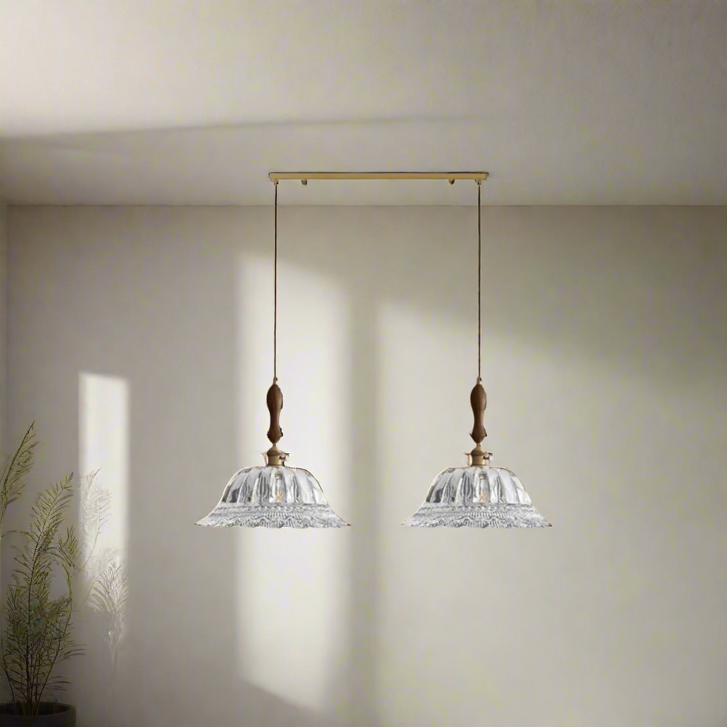 Two crystal pendant lights with wooden accents on a beige background