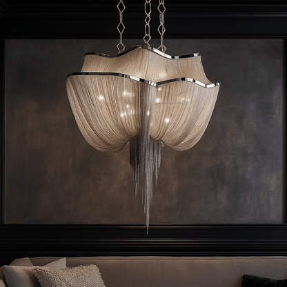 Decorative chandelier hanging above a sofa with a dark wall background