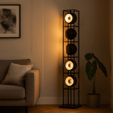 Tall floor lamp with multiple light fixtures in a living room setting.