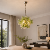Modern chandelier hanging above a dining table in a stylish room.