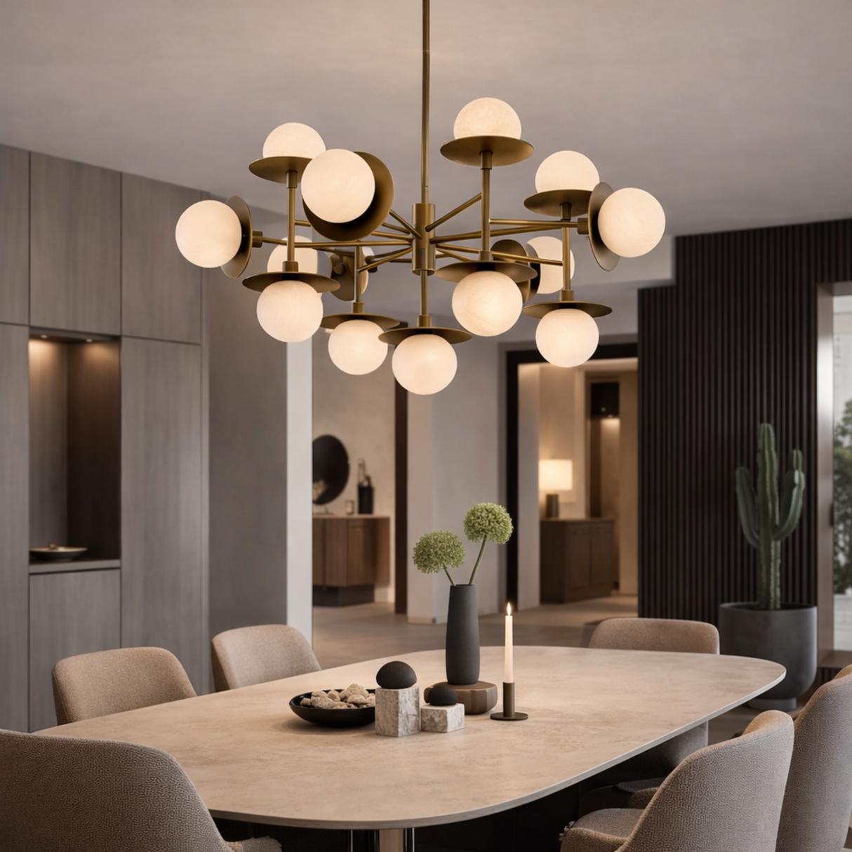 Modern chandelier hanging above a dining table in a stylish room.