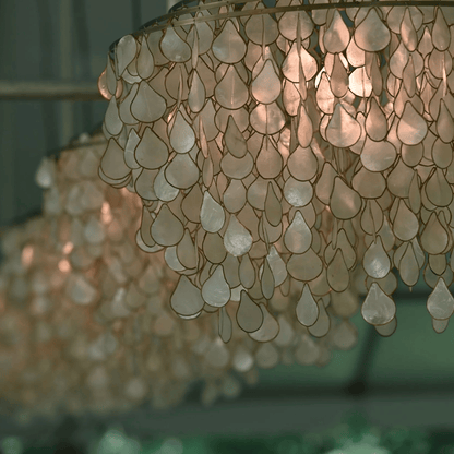 Close-up of a decorative chandelier with shell-like elements.