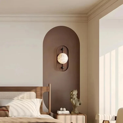 Modern bedroom decor featuring a wooden wall lamp with soft marble glow.