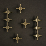 Set of bronze decorative elements on a dark background