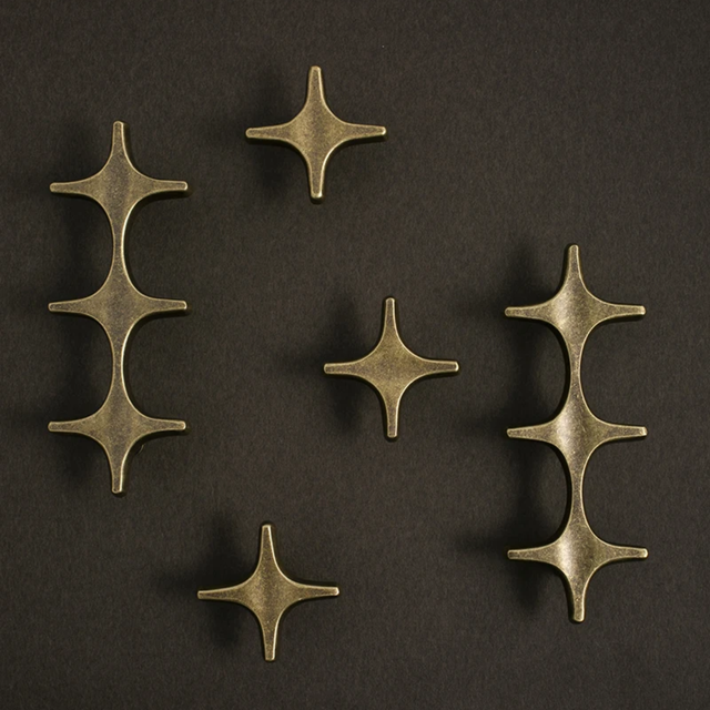 Set of bronze decorative elements on a dark background