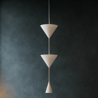Modern pendant light with three tiered conical design against a dark background