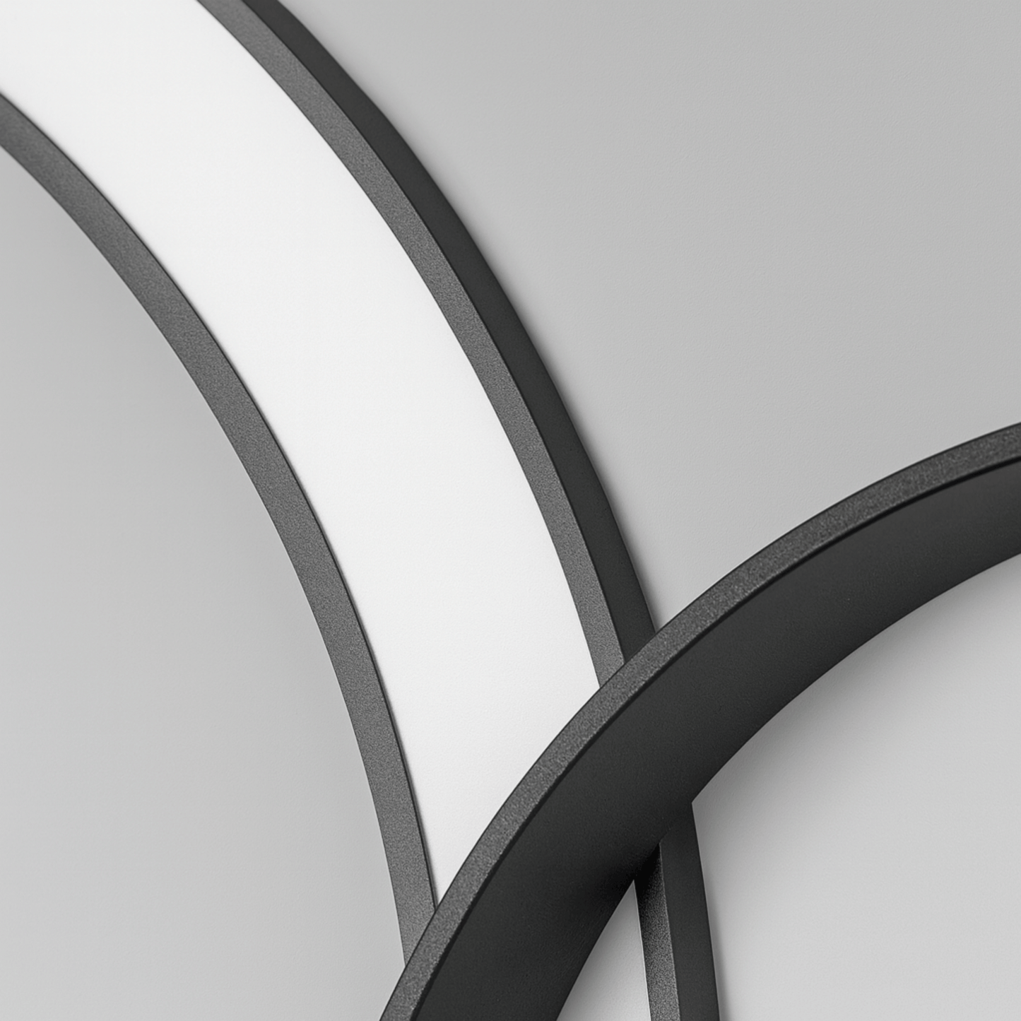 Close-up of curved metal frames on a gray background
