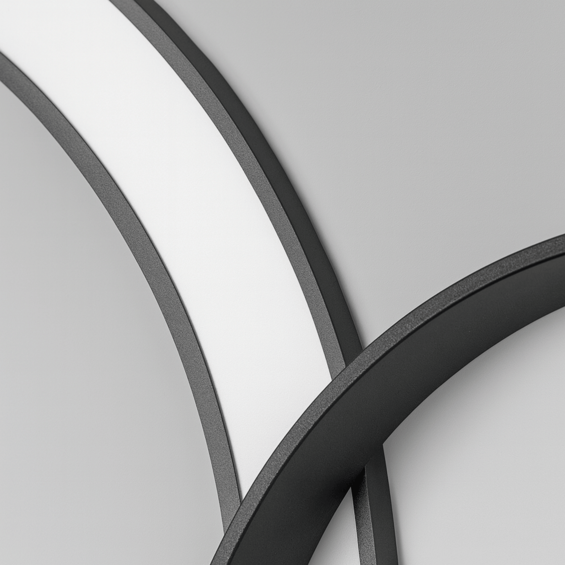 Close-up of curved metal frames on a gray background