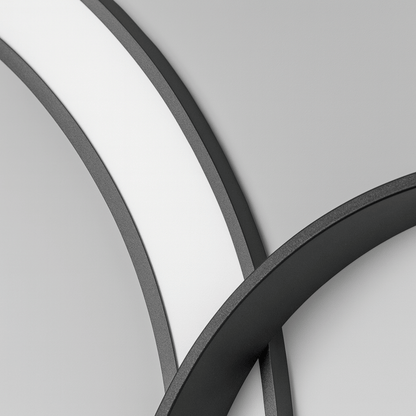 Close-up of curved metal frames on a gray background