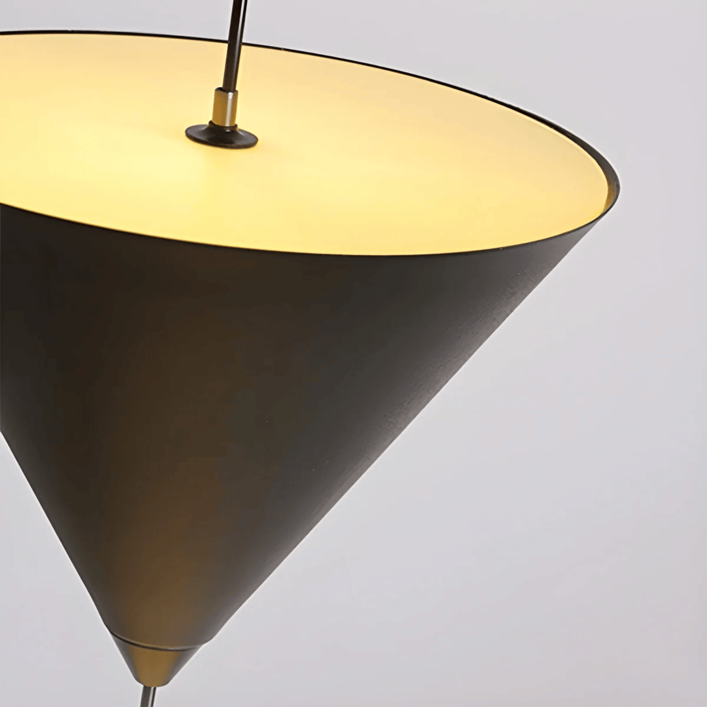 Conical lamp with a yellow interior on a gray background
