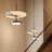 Modern pendant lights hanging above a staircase in a home interior.
