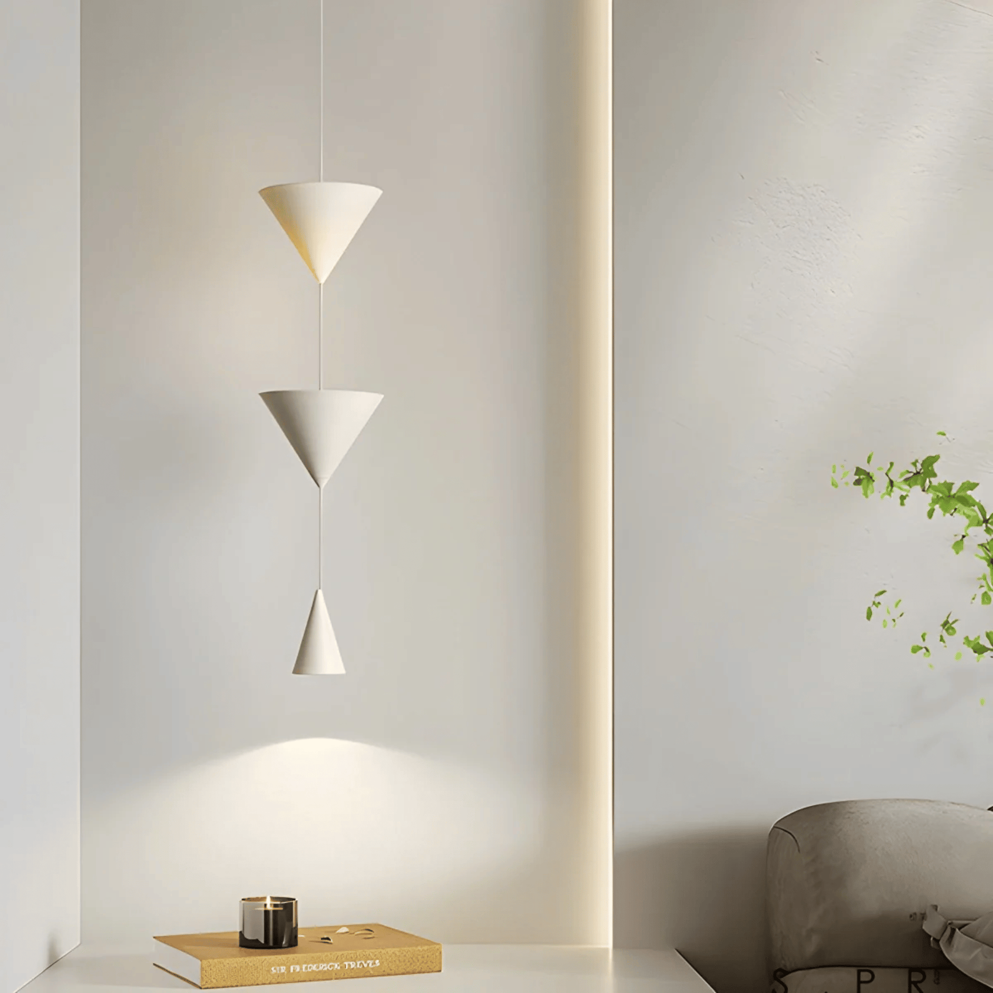 Modern pendant light fixture in a minimalistic room setting with a plant and books.