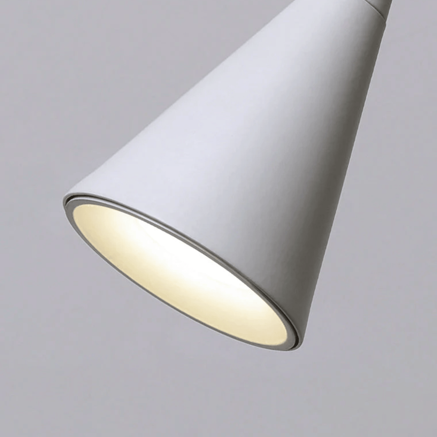 Conical lampshade with a light gray finish on a neutral background