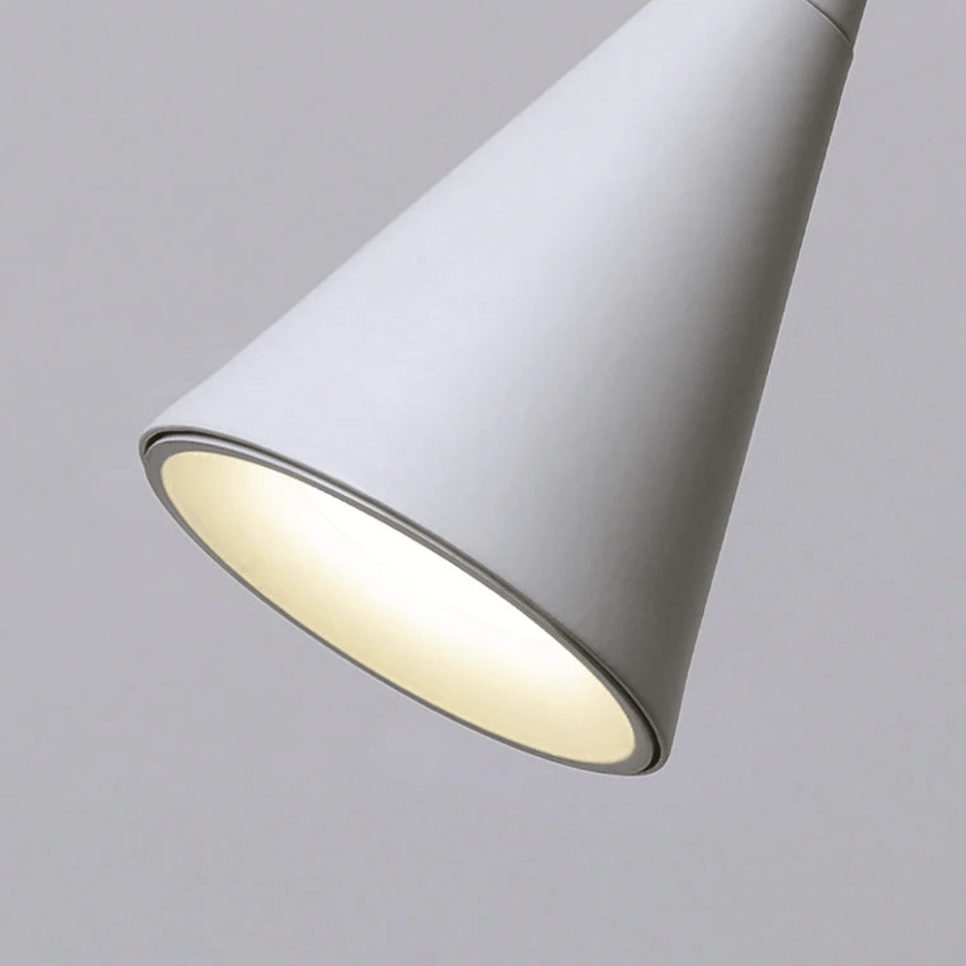 Conical lampshade with a light gray finish on a neutral background