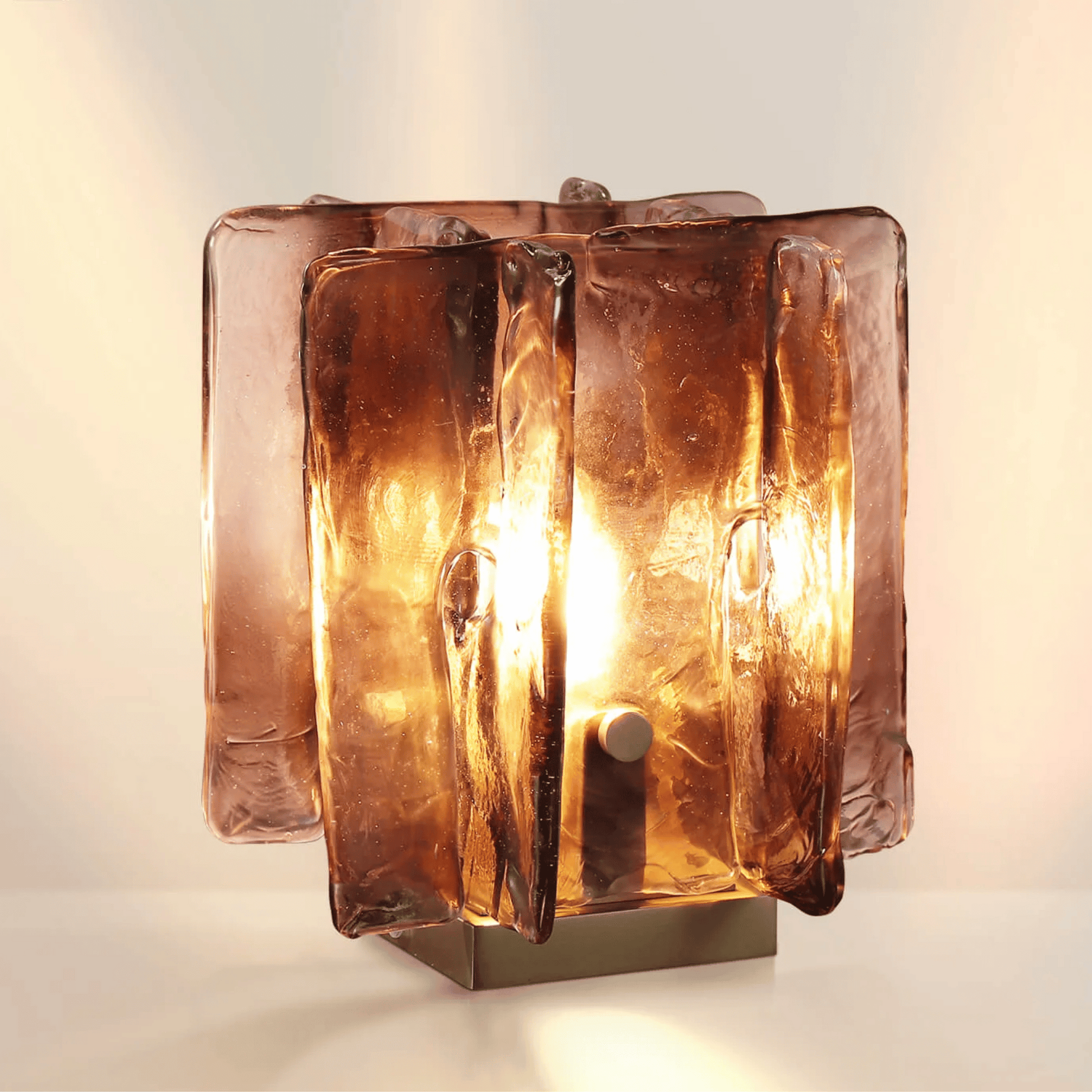 Glass table lamp with a textured design on a beige backround