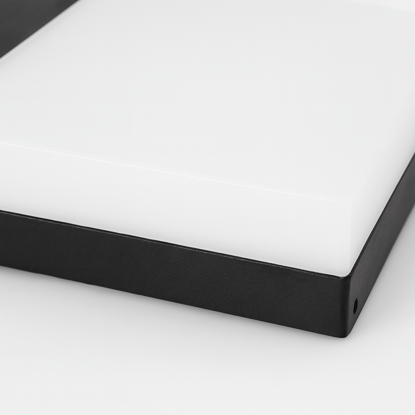 Close-up of a black frame corner on a white background